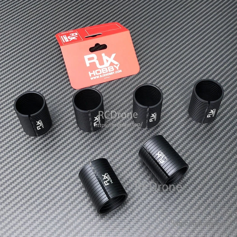 RJX Hobby black diameter-changing adapter sleeves for drone arm tubes, ribbed split clamps with RX logo and packaging