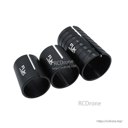 RJX split adapter sleeve set for changing arm tube diameters, black ribbed cylinders with RJX logo