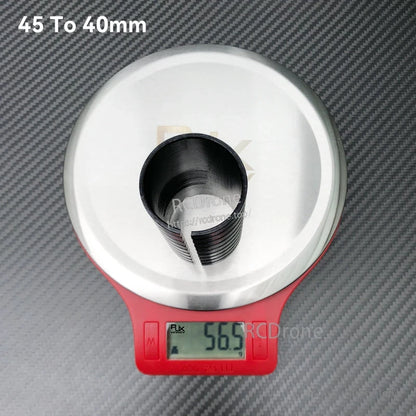 RJX 45mm to 40mm diameter-changing adapter sleeve for arm tube, black insert on scale reading 56.5g