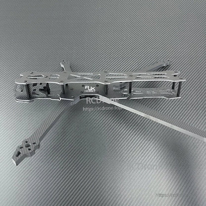 Carbon fiber FPV racing drone frame kit with extended arms, top and bottom plates, and standoff posts