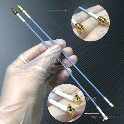 Two blue SMA coax extension cables with gold RF connectors for a GNSS/GPS receiver antenna connection