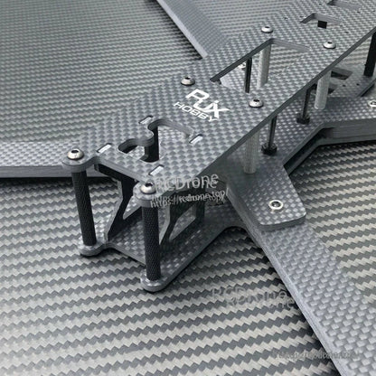 Close-up of RJX carbon fiber 10-inch FPV racing drone frame kit with stacked plates, standoffs, and screws.