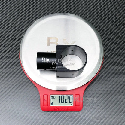 RJX aluminum landing gear tube connector on digital scale showing 102.0 g weight