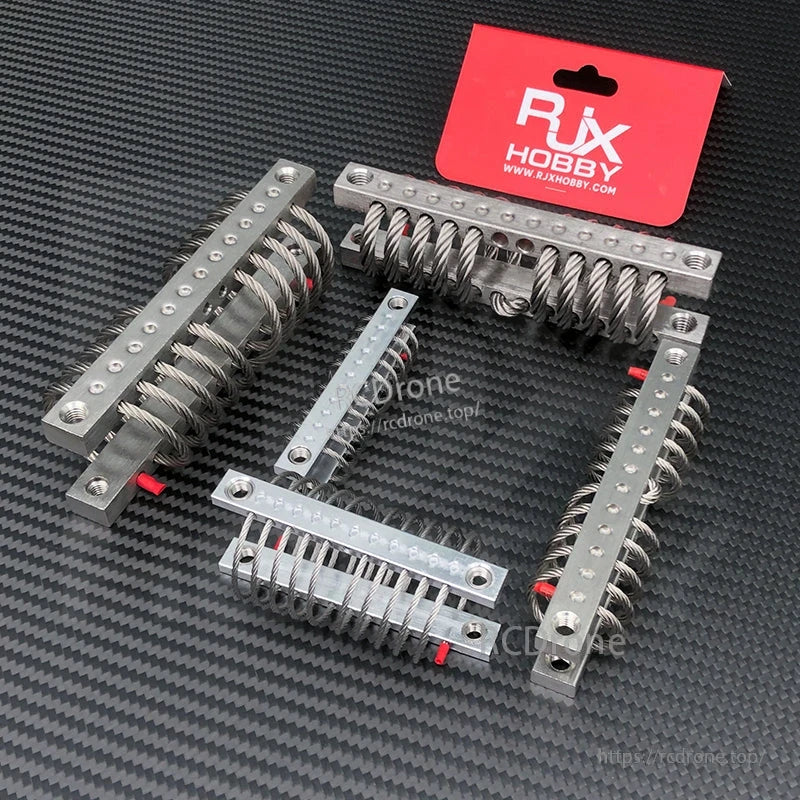 Four RJX Hobby steel wire rope isolators with aluminum mounting bars and bolt holes for UAV gimbal damping