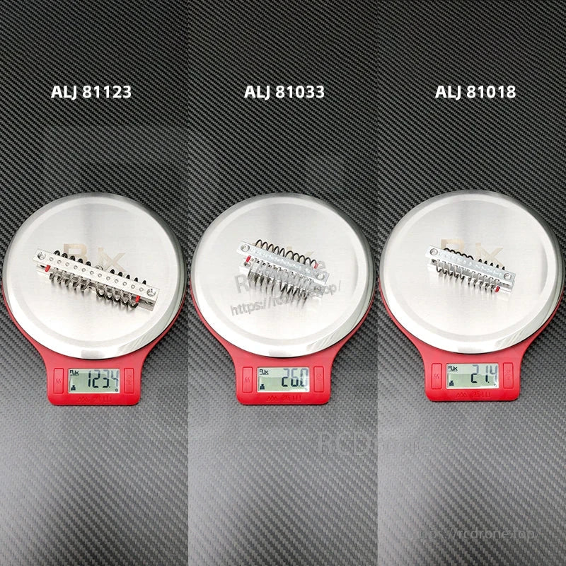 Wire rope vibration isolators on digital scales labeled ALJ 81123, ALJ 81033 and ALJ 81018 with weights