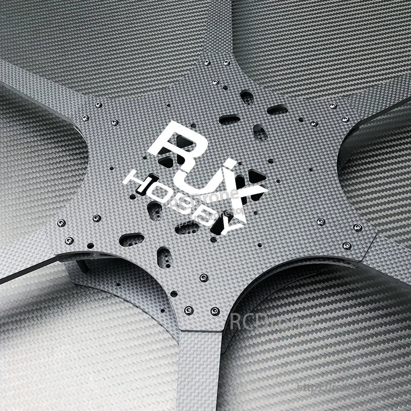 Close-up of RJX Hobby carbon fiber FPV drone frame center plate with mounting holes and six arm cutouts