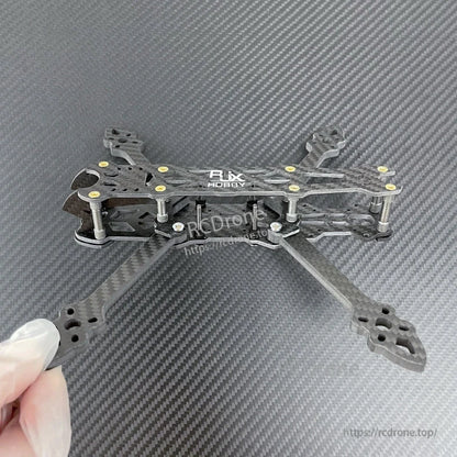 RJX carbon fiber 5-inch FPV racing drone frame kit with four arms, matte twill plates, and standoffs