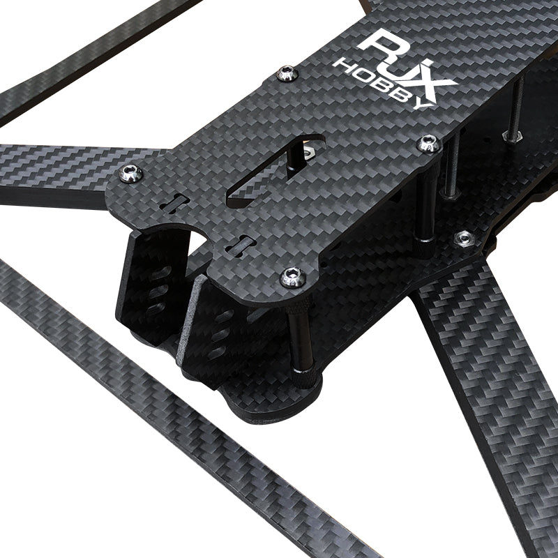 RJX Mark4 V3 Pro carbon fiber FPV drone frame kit close-up with top plate, standoffs, and arms