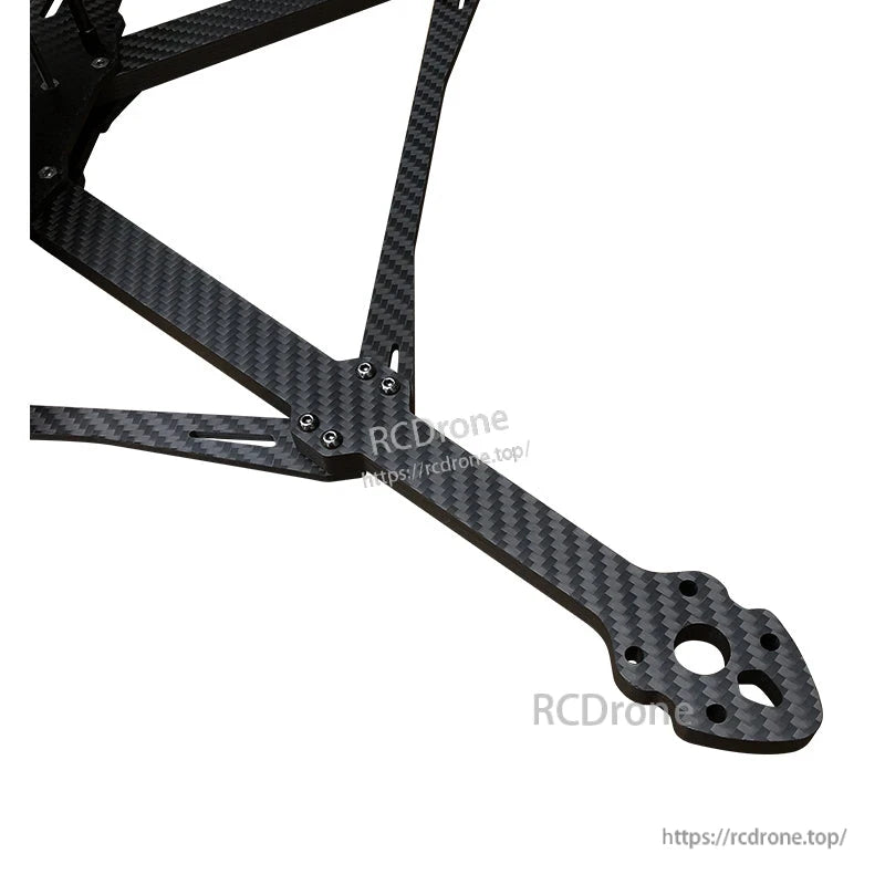 Close-up of RJX Mark4 V3 Pro carbon fiber FPV drone frame arm with motor mounting holes and screws