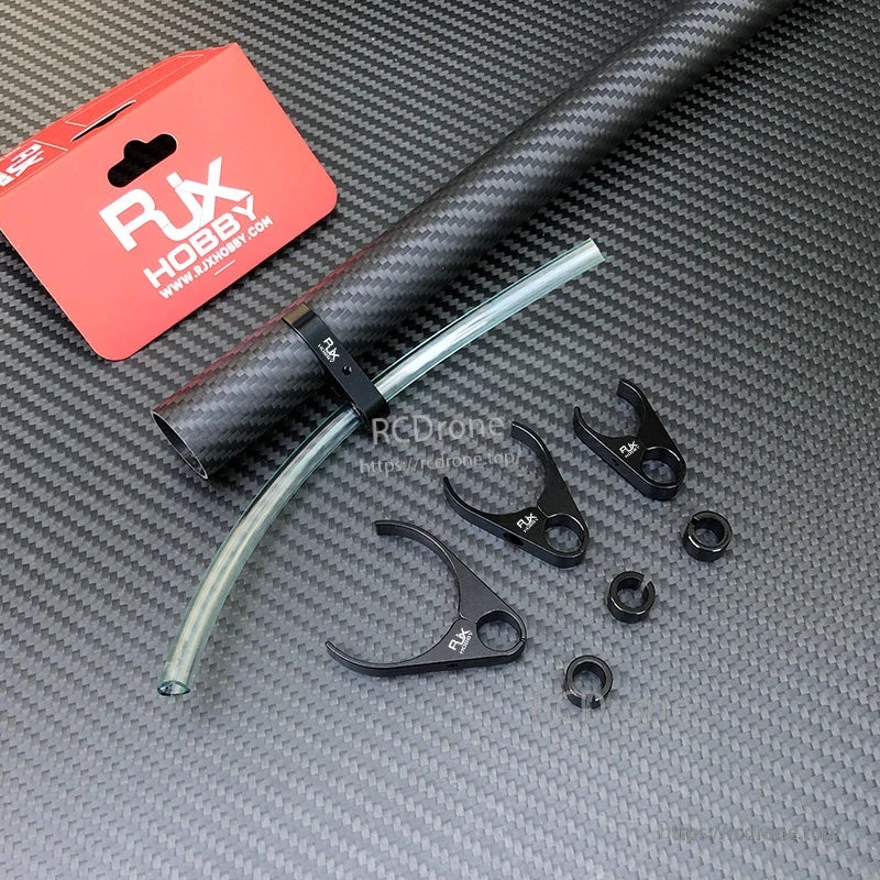 RJX plastic water pipe clamp securing a clear hose to a carbon fiber tube, with additional clamp pieces