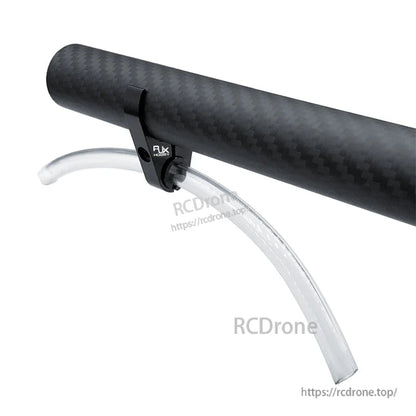 RJX plastic water pipe clamp holding a clear hose on a carbon fiber tube, drone spray line mount