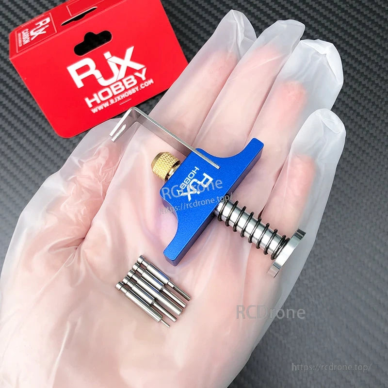 RJX Propeller Removal Tool, RJX blue aluminum propeller removal tool with spring-loaded screw and metal pin set, in RJX Hobby packaging