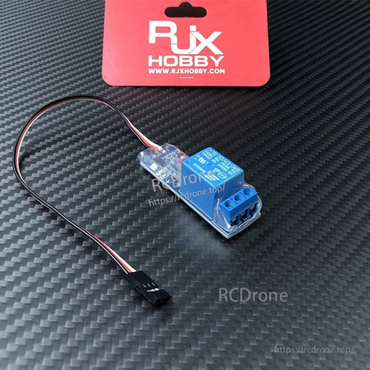 RJX RC PWM electronic relay switch module with servo-style lead and blue screw terminal output