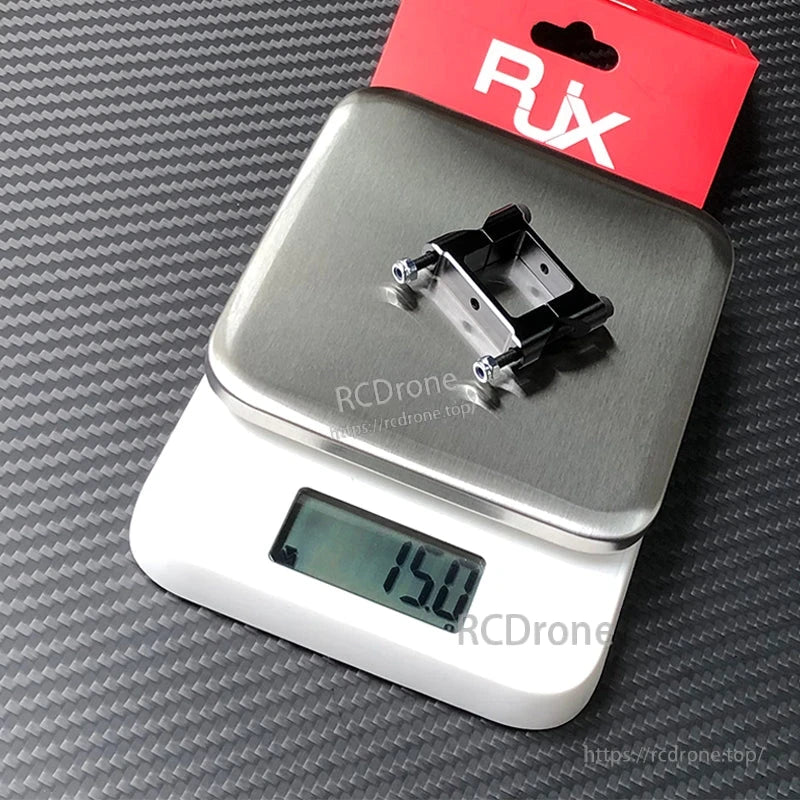 RJX square aluminum tube clamp with screws and nuts on a digital scale reading 15.0 g