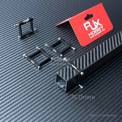 RJX Square Aluminum Tube Clamp, RJX Hobby square aluminum tube clamps with mounting screws on a carbon-fiber surface