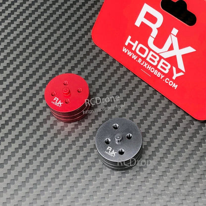 Red and black RJX Hobby quick release self-tightening propeller mount adapters for RC multirotor drones