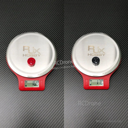 Two RJX Hobby quick release propeller mount adapters on digital scales, each weighing about 17g