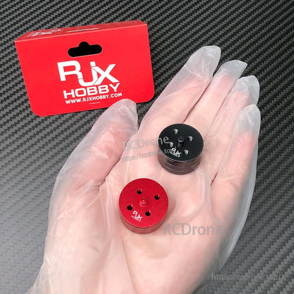 RJX Hobby quick-release self-tightening propeller mount adapters (CW/CCW) in red and black, multi-hole top