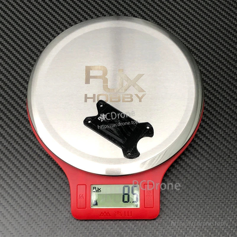 RJX TPU 3D Printed GoPro Mount, RJX TPU 3D printed GoPro-style mount on a digital scale reading 8.5 g