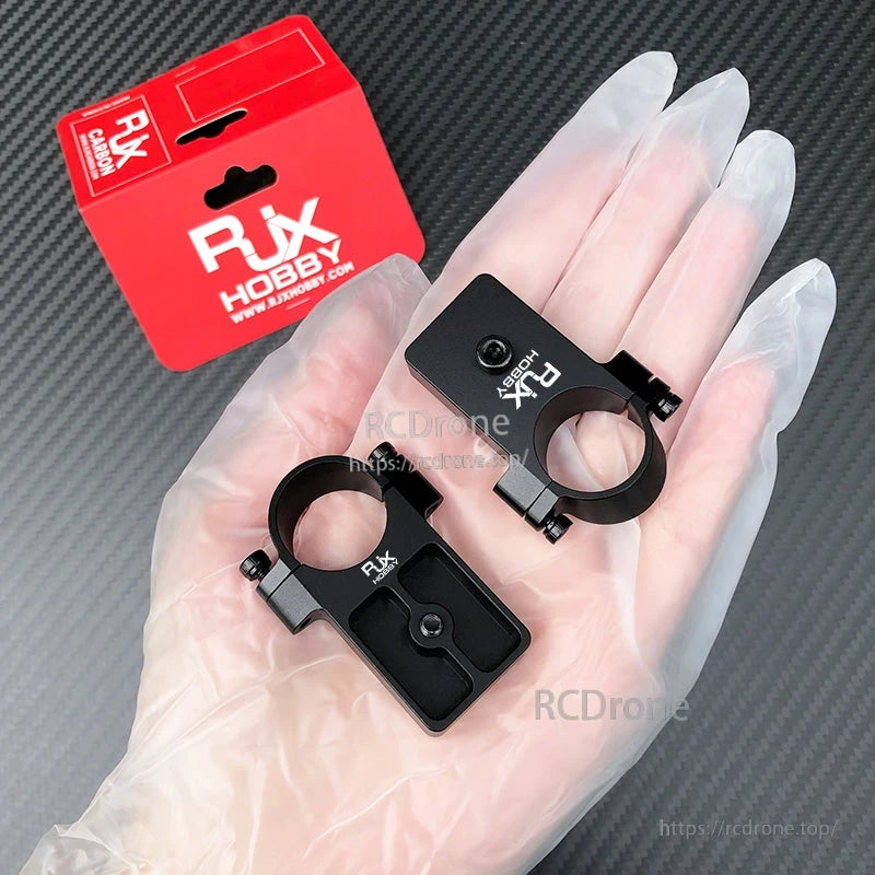RJX UAV Drone Tube Mount, RJX Hobby UAV drone tube mount clamp set in black aluminum with screws, shown with RJX packaging