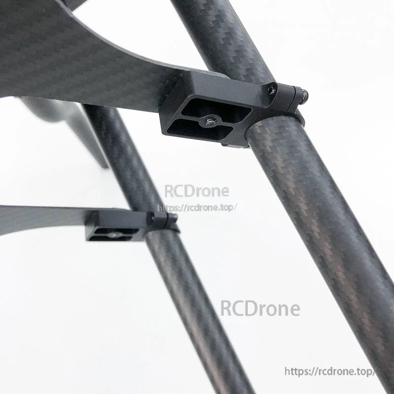 RJX UAV drone tube mount clamp attached to carbon-fiber tubes, showing the bracket and screw fastener