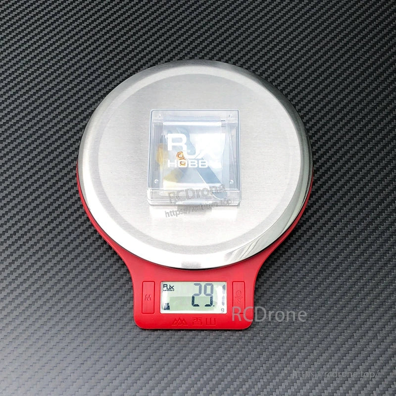 RJX V3 M3L anti-slip gimbal stick in a clear box on a digital scale reading 29 g