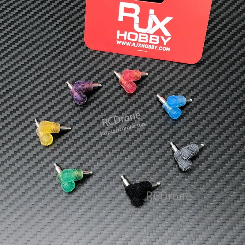 RJX V3 M3L anti-slip gimbal stick ends with textured grips, shown in multiple colors on a carbon-fiber background