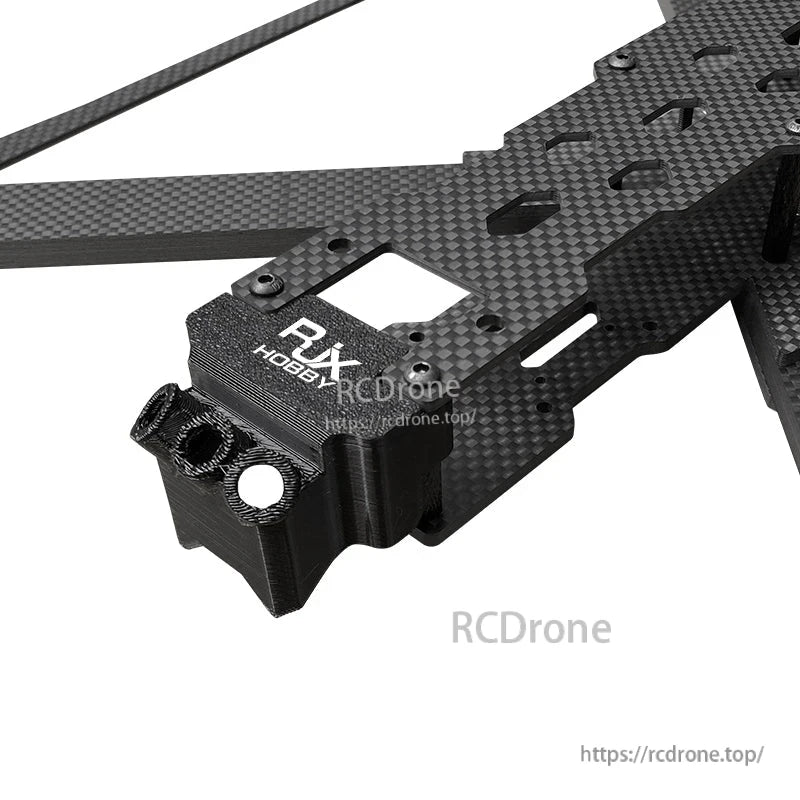 RJX X13 carbon fiber FPV drone frame section with thick arm plates and a 3D-printed front mount block