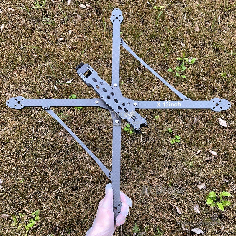 RJX X13 13-inch carbon fiber X-frame kit for FPV drone with long arms and center plate on grass