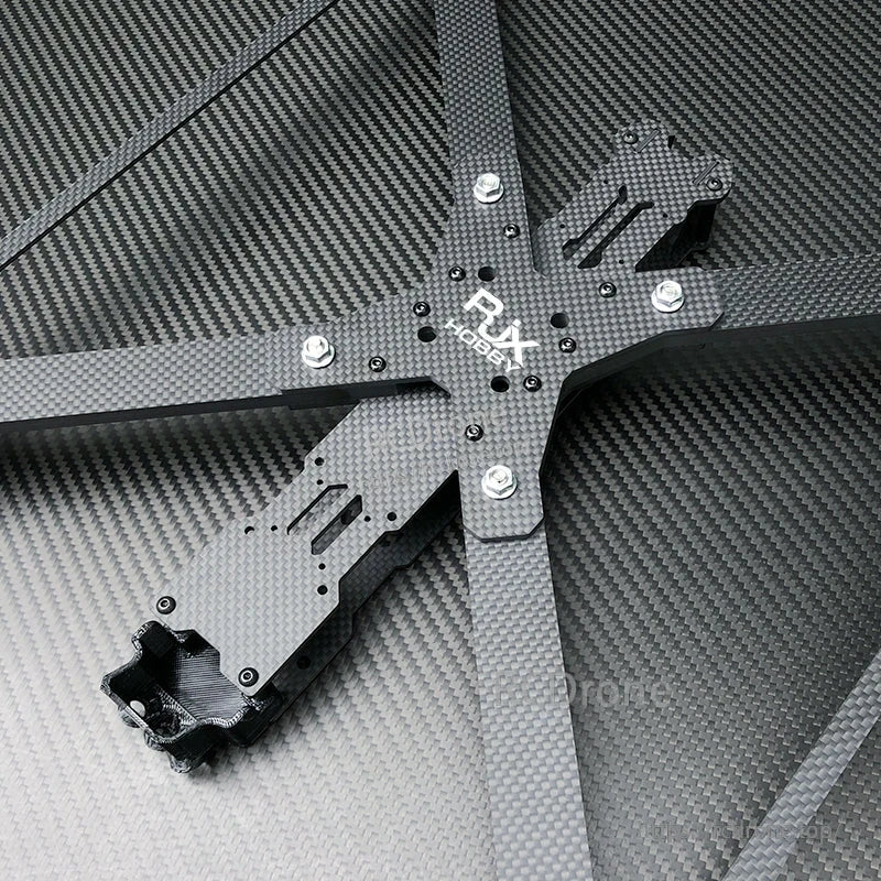 RJX X13 carbon fiber FPV racing drone frame center section with X-style arms, mounting slots, and hardware