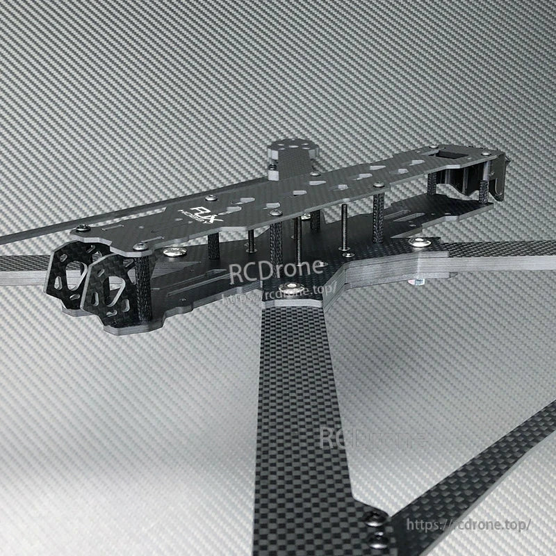 RJX carbon fiber FPV racing drone frame with long arms, top plate, standoffs, and motor mount end