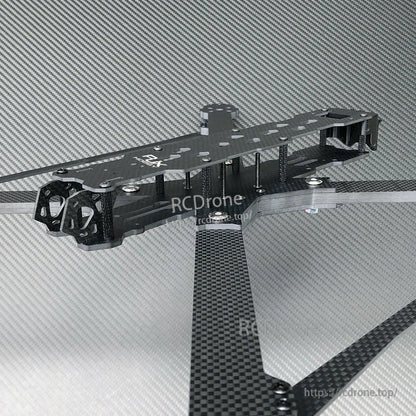 RJX carbon fiber FPV racing drone frame with long arms, top plate, standoffs, and motor mount end