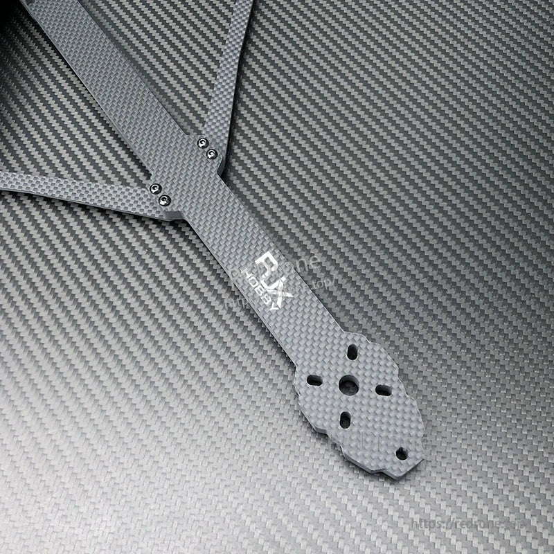 RJX X15 carbon fiber FPV drone frame arm with motor mounting holes and bolt hardware close-up