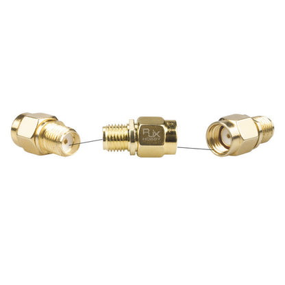 Gold RF coaxial adapter with hex body, converting SMA female to RP-SMA male threaded connector
