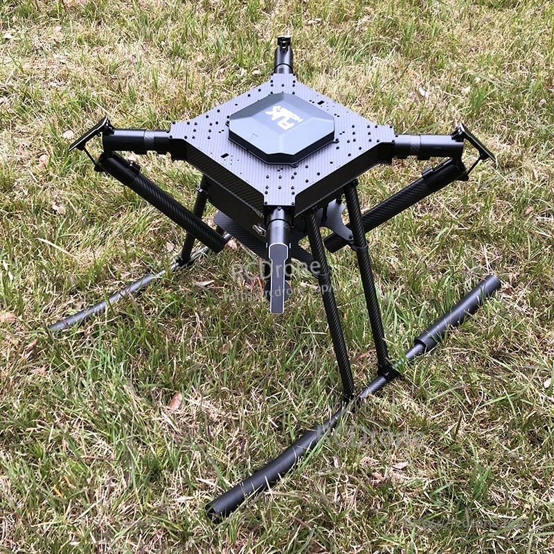 RJX1300C carbon fiber folding quadcopter frame with four arms, center plate, and tall landing gear