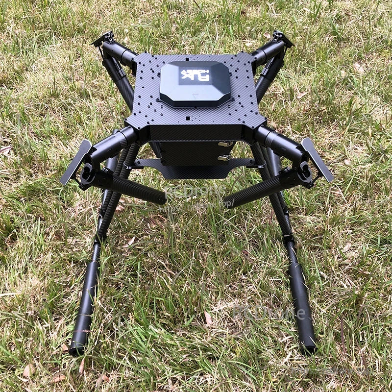 RJX1300C 1300mm carbon fiber folding quadcopter frame with landing gear, set up on grass
