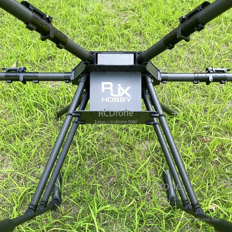 RJX1850A carbon fiber umbrella folding hexacopter frame with landing gear and RJX Hobby center plate on grass