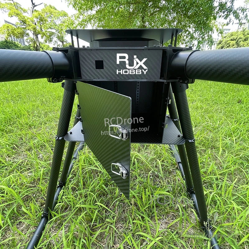Close-up of RJX Hobby carbon fiber hexacopter frame center plate with tubular arms, landing gear and battery trays