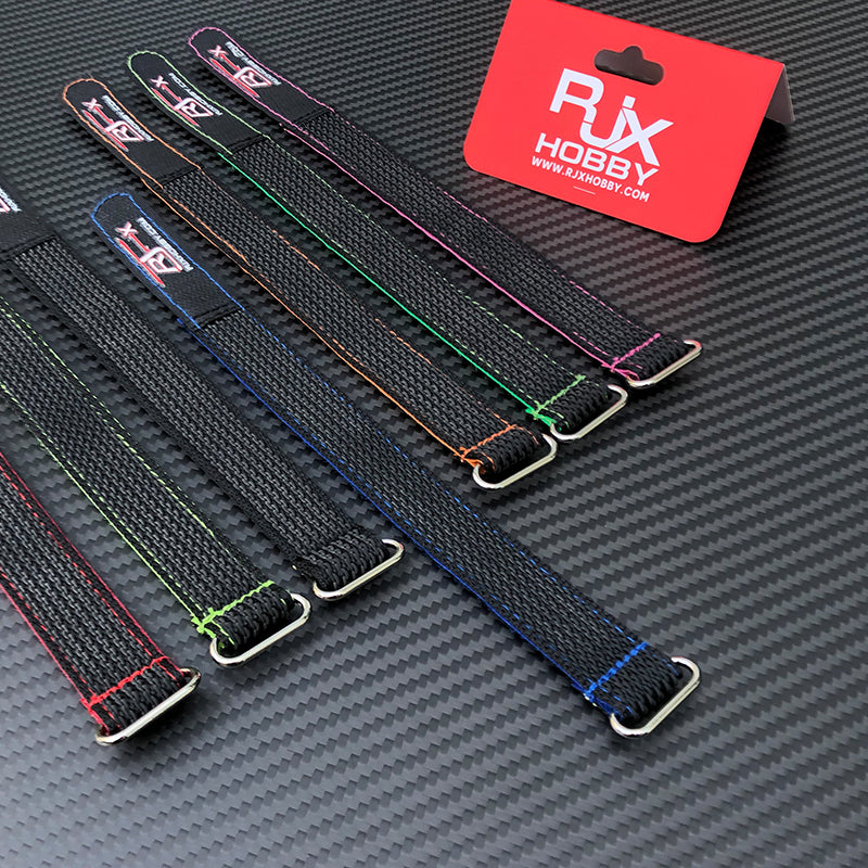 RJXHOBBY RC battery straps with colored stitching and metal buckles on a carbon fiber surface