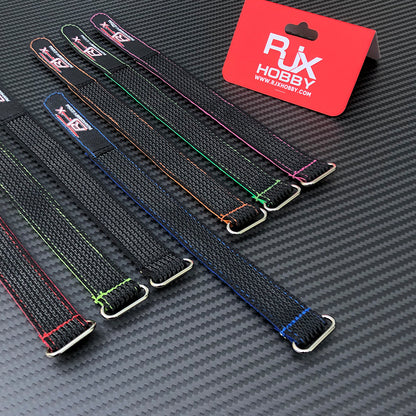 RJXHOBBY RC battery straps with colored stitching and metal buckles on a carbon fiber surface