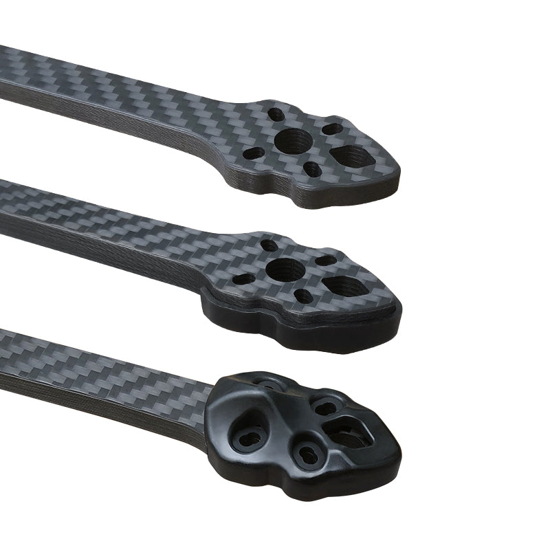 Carbon fiber frame kit for RC drones with various parts for assembly.