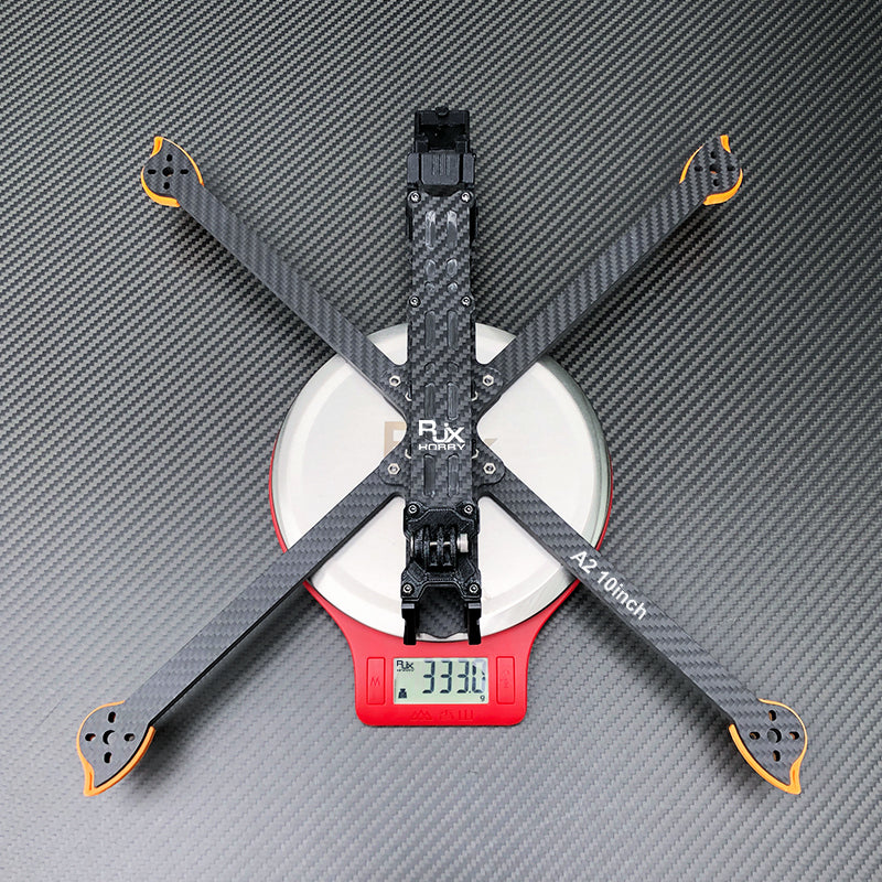 RJX A2 10-inch carbon fiber FPV racing drone frame kit in X layout, shown on a scale reading 333.1 g