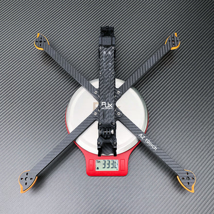 RJX A2 10-inch carbon fiber FPV racing drone frame kit in X layout, shown on a scale reading 333.1 g