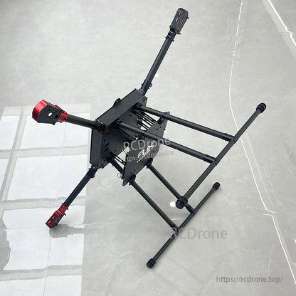 RJX900-style 900mm carbon fiber folding quadcopter frame with landing gear and red motor mounts