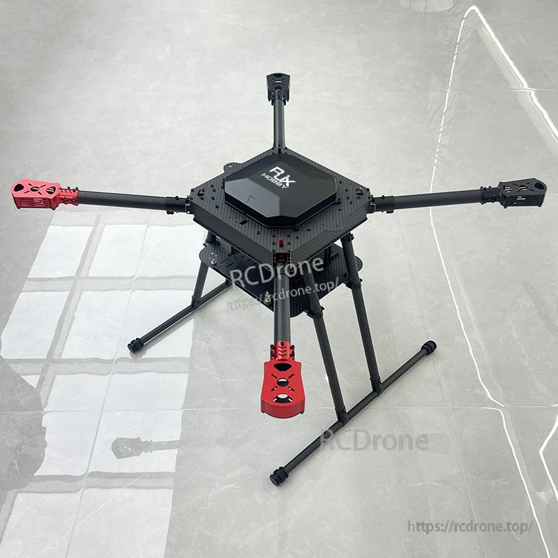 RJX900 carbon fiber folding quadcopter frame kit with landing gear, central body plate, and red motor mounts