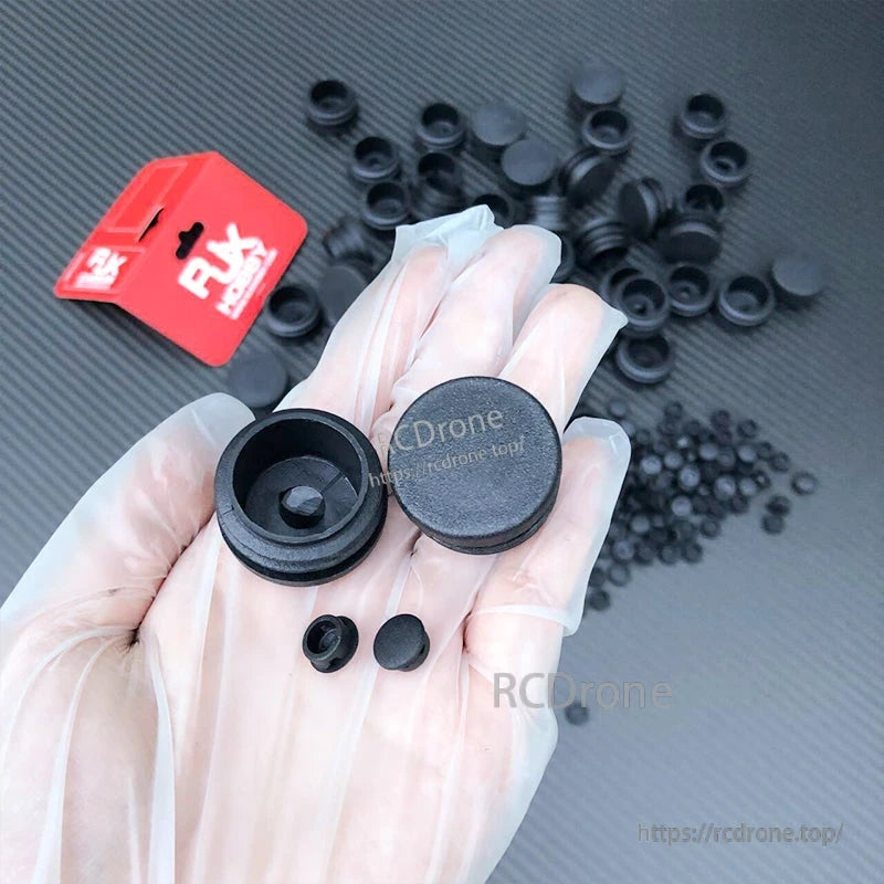 RJXHOBBY 10pcs Carbon Fiber Pipe Plug, Assorted black pipe plug end caps for carbon fiber tubes, with multiple sizes displayed in a hand