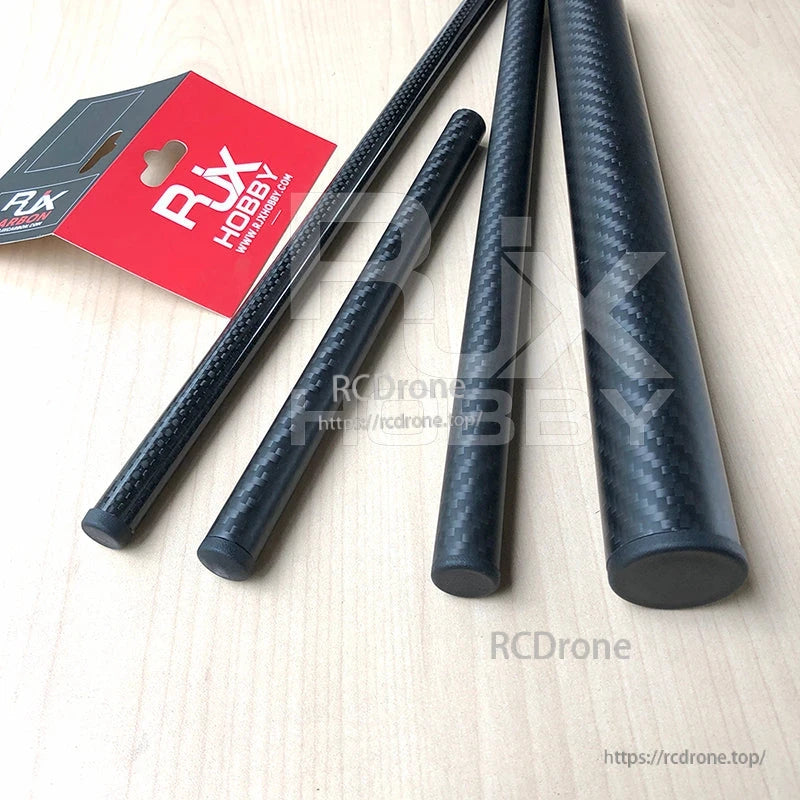 RJXHOBBY 10pcs Carbon Fiber Pipe Plug, RJXHOBBY carbon fiber tubes with black round pipe plugs on a tabletop, shown with branded packaging tag