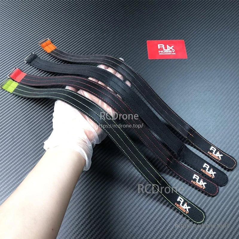 RJXHOBBY 1pc 25mm Kevlar Battery Strap, RJXHOBBY 25mm RC battery straps with colored pull tabs and RJX HOBBY logo, black stitched webbing