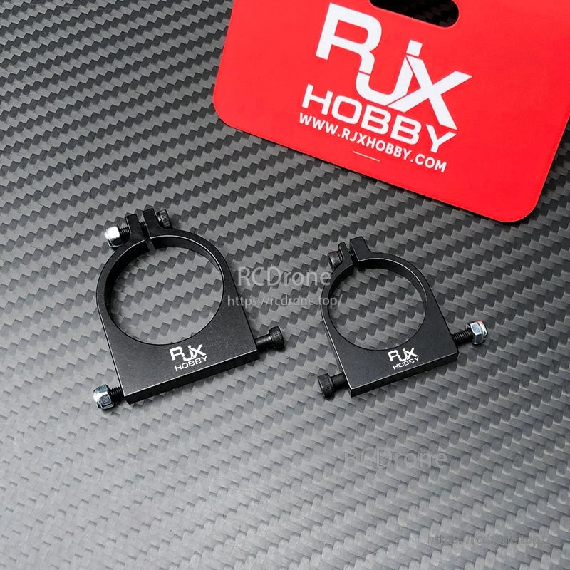 RJXHOBBY 1pc 25mm/30mm Pipe Clamp, Two black RJXHOBBY pipe clamp mounts with bolt fasteners for attaching accessories to round tubing