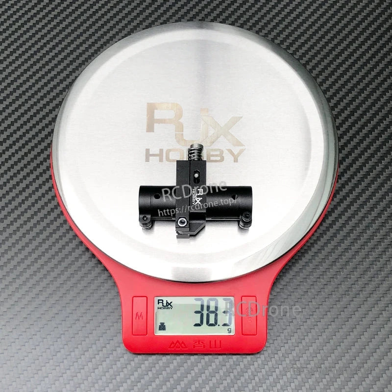 RJXHOBBY CNC aluminum folding arm tube joint for FPV drone, black 16mm clamp, shown on scale at 38.3g